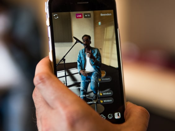 Smartphone with livestream of a singer